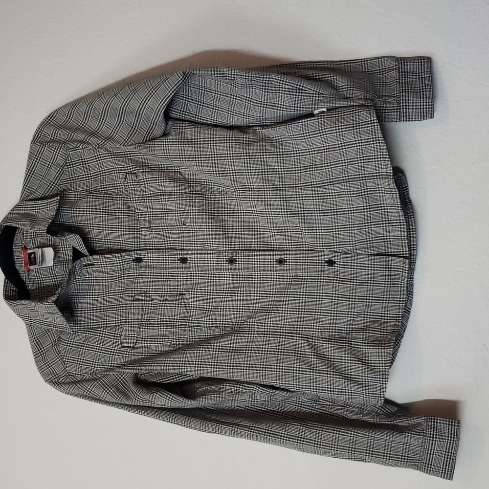 The North Face size small. Button down checkered long sleeve shirt.